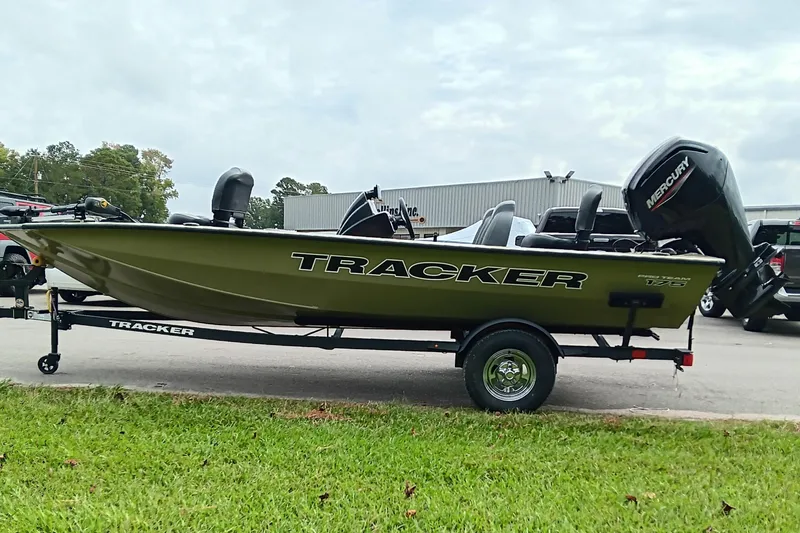Slide: The Image of 2026 Tracker Pro Team 175 boat on trailer, parked outdoors. - 6