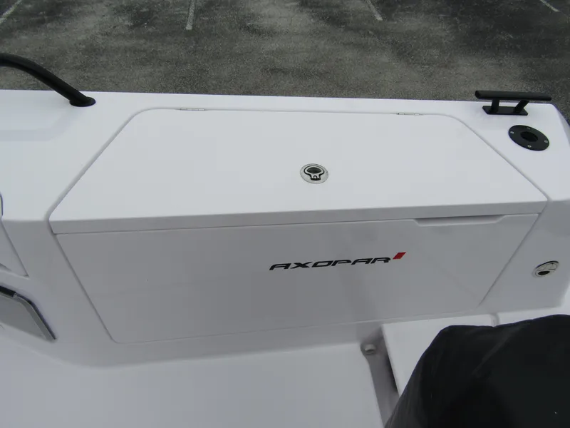 Slide: The Image of 2024 Axopar 37XC CROSS CABIN deck detail with storage compartment. - 32
