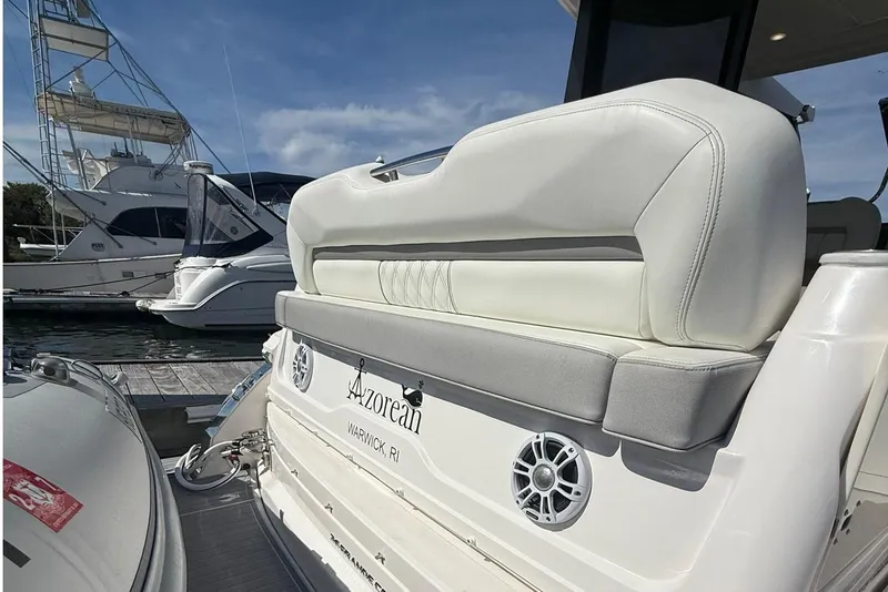 Slide: The Image of Anchor compartment of 2021 Regal 36 Grande Coupe boat, docked with visible equipment. - 13