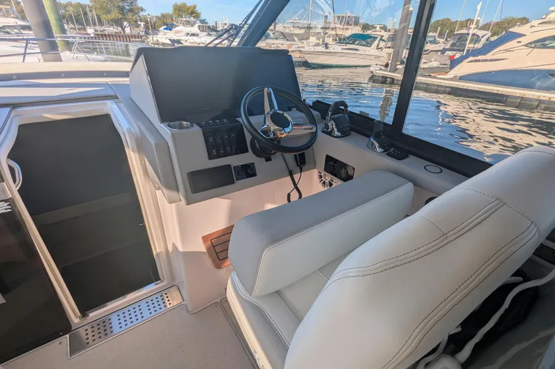 Slide: The Image of Interior of 2021 Regal 36 Grande Coupe yacht with luxurious seating and modern design. - 16