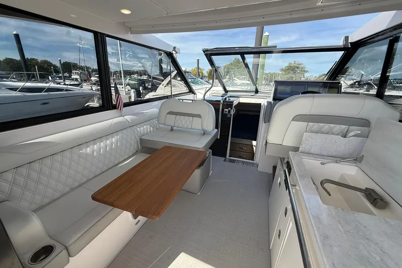 Slide: The Image of Control panel of 2021 Regal 36 Grande Coupe boat with throttle and joystick. - 21