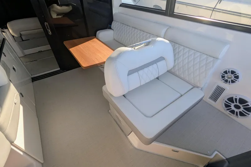 Slide: The Image of Luxurious interior of 2021 Regal 36 Grande Coupe with elegant seating and wooden table. - 27