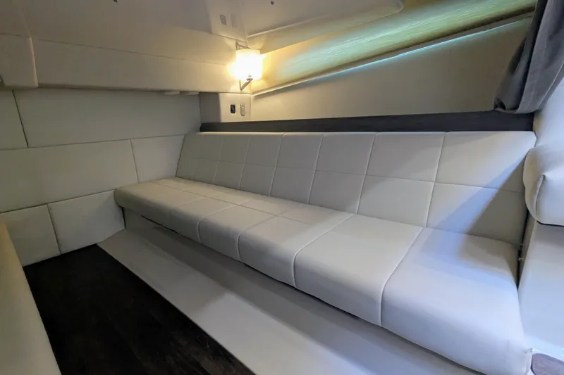 Slide: The Image of Interior cabin of 2021 Regal 36 Grande Coupe with modern design and window view. - 41