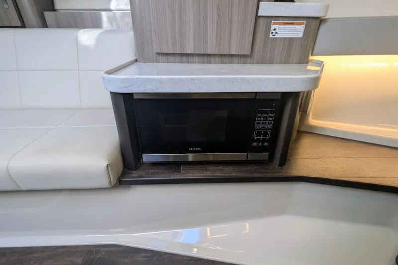 Slide: The Image of Interior of 2021 Regal 36 Grande Coupe with sleek white seating and ambient lighting. - 42