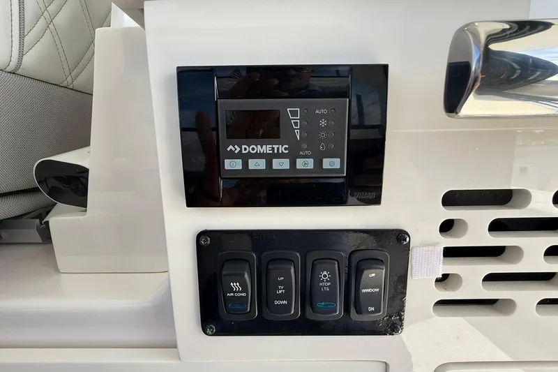 Slide: The Image of Electrical control panel of 2021 Regal 36 Grande Coupe boat. - 46