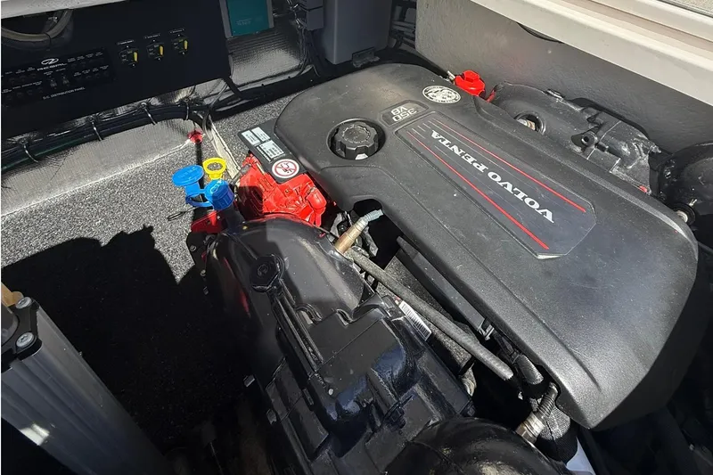 Slide: The Image of Engine compartment of 2021 Regal 36 Grande Coupe, showcasing mechanical components and wiring. - 48