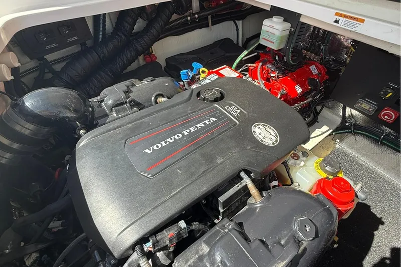 Slide: The Image of Engine room of 2021 Regal 36 Grande Coupe with control panel and red components. - 50