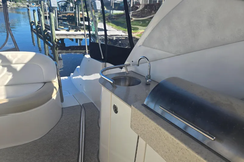 Slide: The Image of Interior of 2010 Sea Ray 330 Sundancer with sink and seating area. - 20