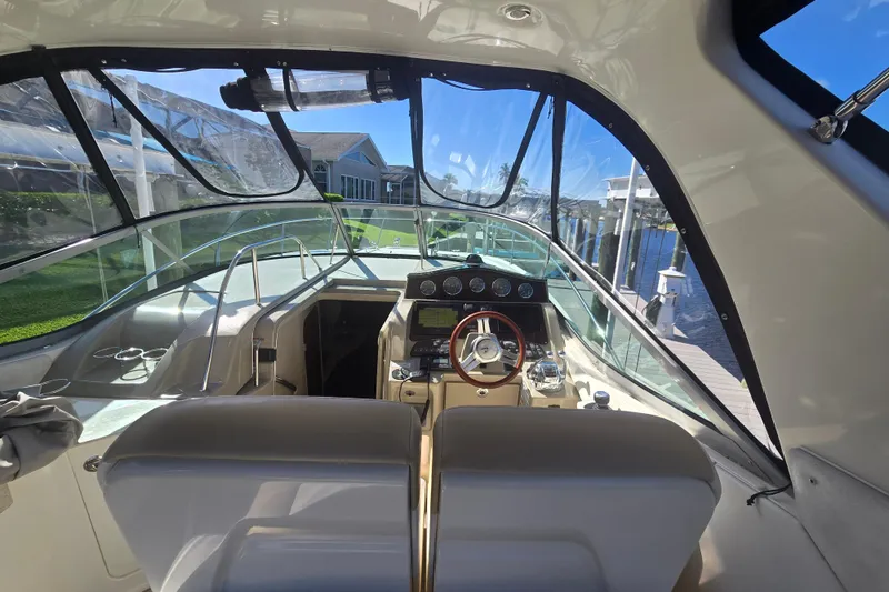 Slide: The Image of Interior view of 2010 Sea Ray 330 Sundancer yacht cockpit with steering wheel. - 24