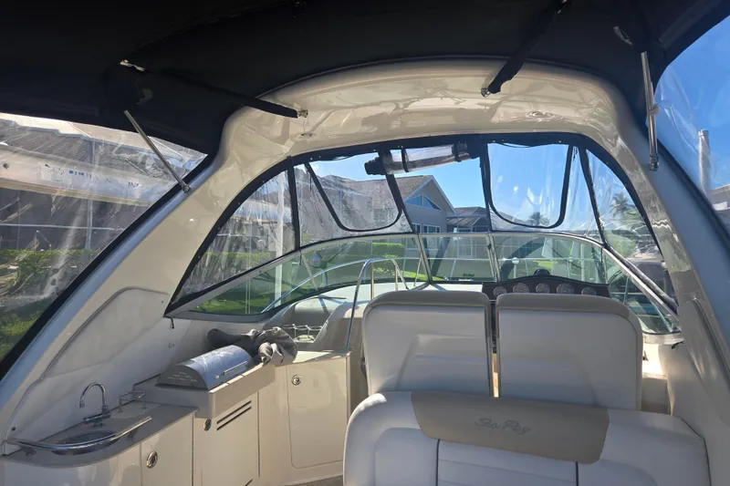 Slide: The Image of Interior view of 2010 Sea Ray 330 Sundancer yacht with seating and helm. - 31