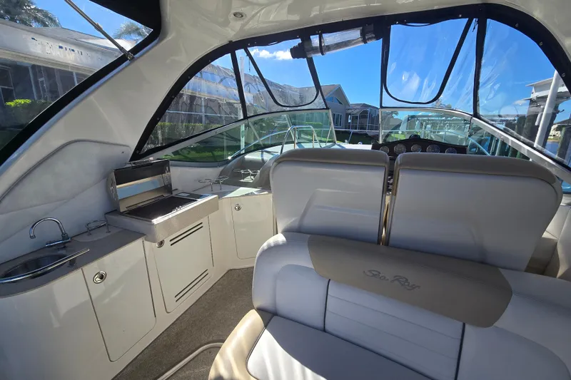 Slide: The Image of Interior of 2010 Sea Ray 330 Sundancer boat with seating and kitchenette. - 36