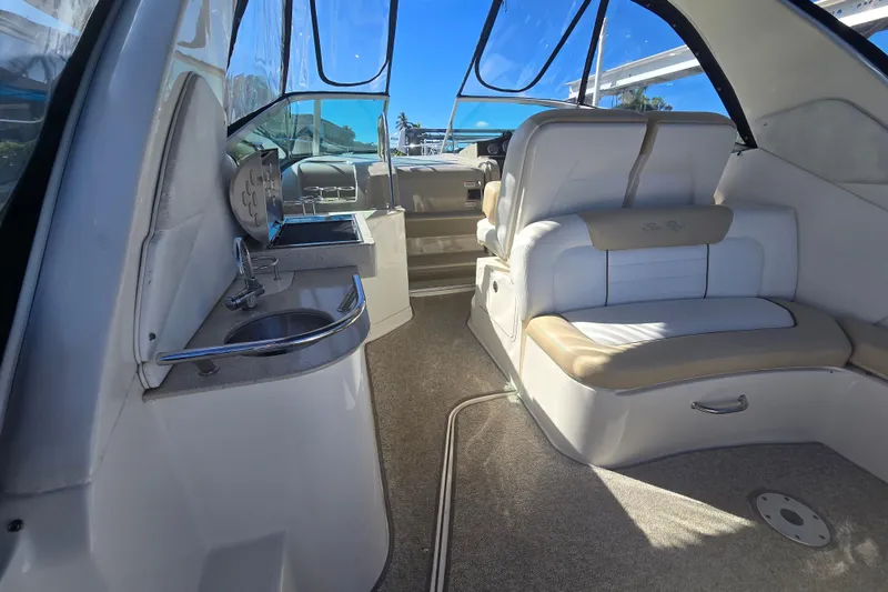 Slide: The Image of Interior of 2010 Sea Ray 330 Sundancer boat with seating and kitchenette. - 37