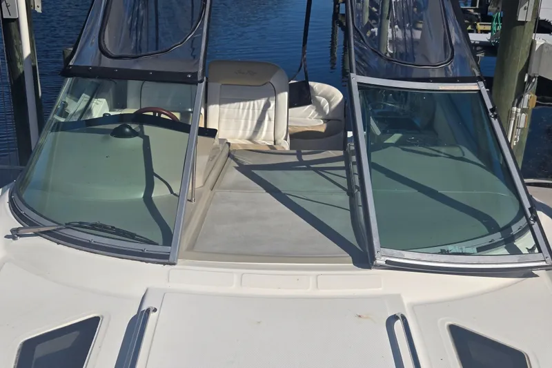 Slide: The Image of 2010 Sea Ray 330 Sundancer boat with open cockpit and clear windshield. - 41
