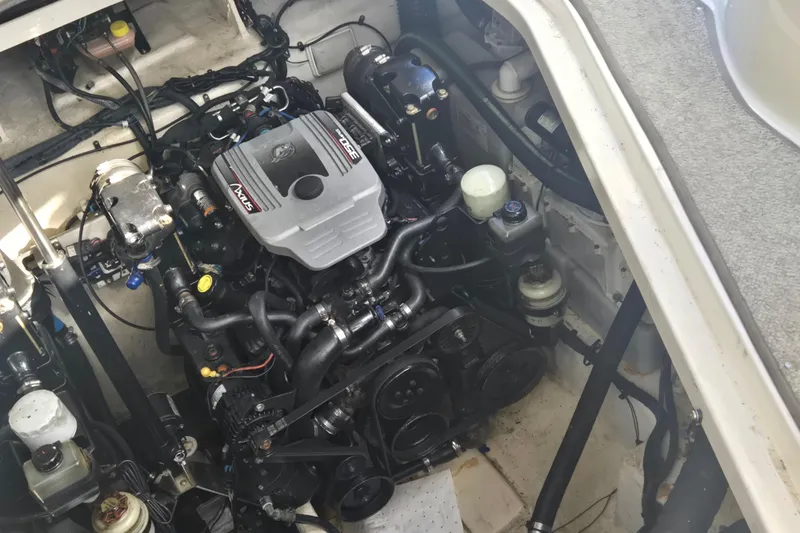 Slide: The Image of Engine compartment of a 2010 Sea Ray 330 Sundancer boat, showcasing detailed mechanical components. - 57