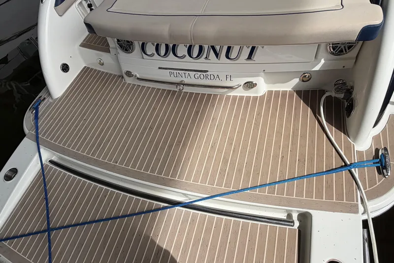 Slide: The Image of 2017 Formula 350 Crossover Bowrider boat deck, named "Coconut," docked in Punta Gorda, FL. - 10