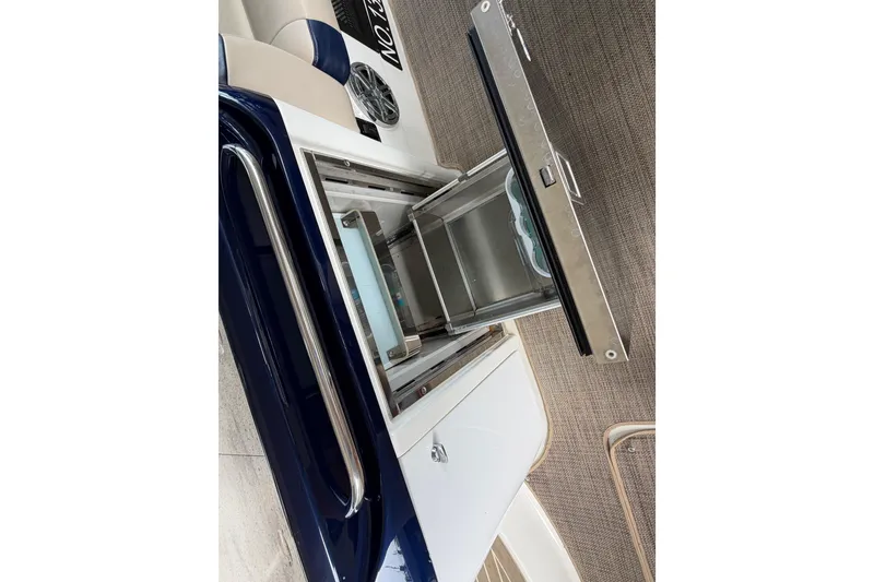 Slide: The Image of 2017 Formula 350 Crossover Bowrider interior with open storage compartment. - 12