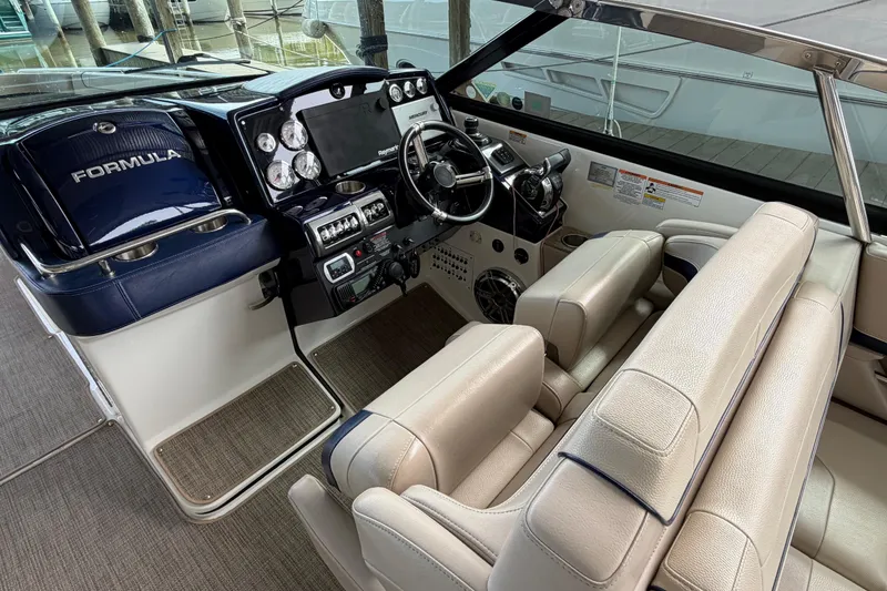 Slide: The Image of 2017 Formula 350 Crossover Bowrider cockpit with luxurious seating and advanced controls. - 13