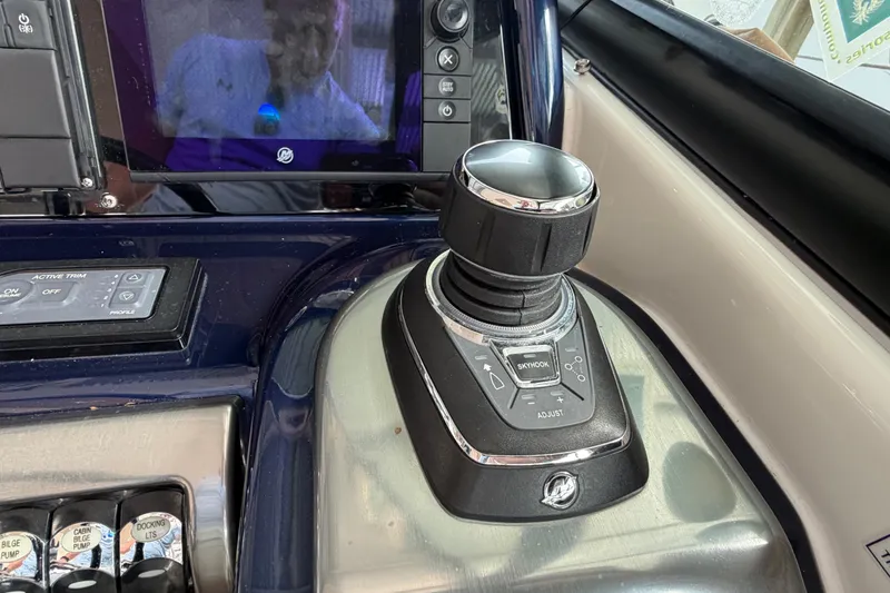 Slide: The Image of Control panel of a 2017 Formula 350 Crossover Bowrider boat with joystick and display. - 15