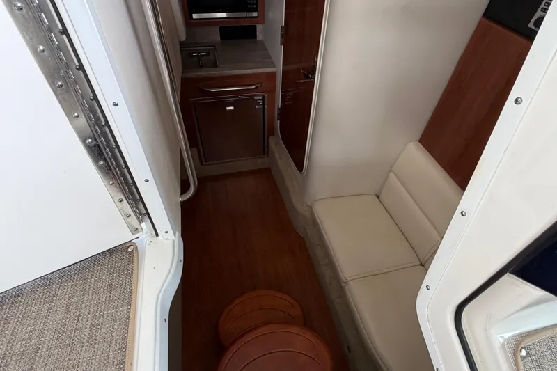 Slide: The Image of 2017 Formula 350 Crossover Bowrider interior with seating and kitchenette. - 16