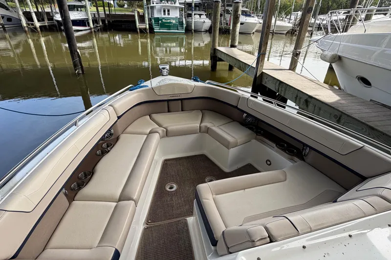 Slide: The Image of 2017 Formula 350 Crossover Bowrider interior with spacious seating at marina. - 21