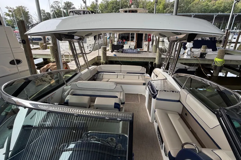 Slide: The Image of 2017 Formula 350 Crossover Bowrider docked, showcasing spacious seating and sleek design. - 24