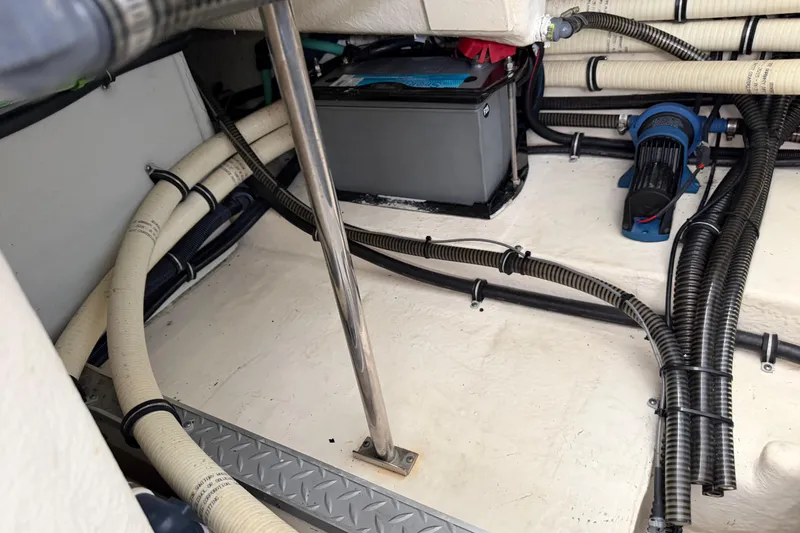 Slide: The Image of 2017 Formula 350 Crossover Bowrider engine compartment with battery and wiring. - 33