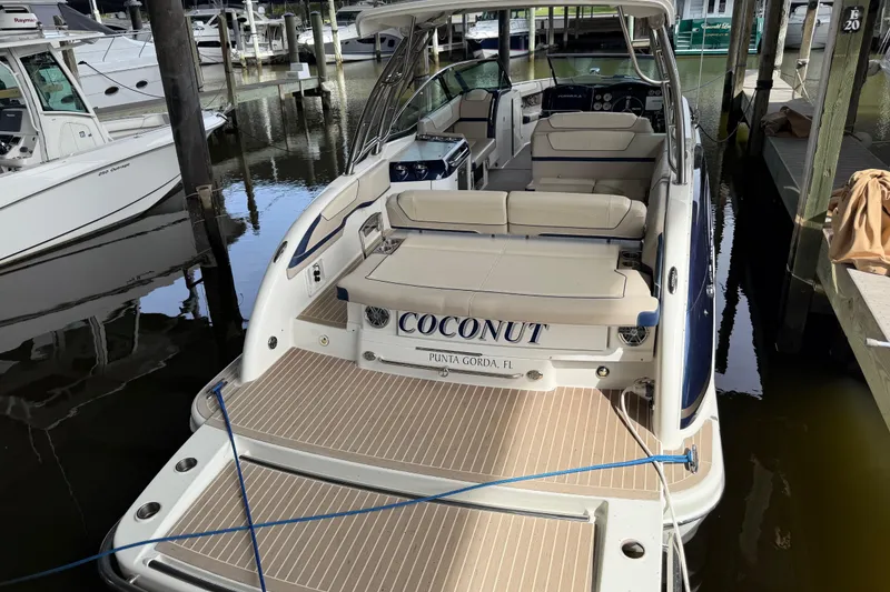 Slide: The Image of 2017 Formula 350 Crossover Bowrider docked, featuring spacious seating and elegant design. - 5