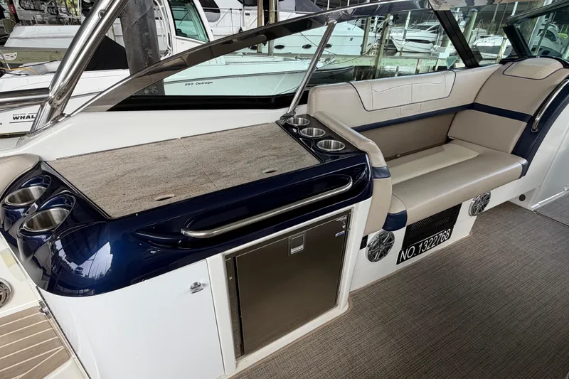 Slide: The Image of 2017 Formula 350 Crossover Bowrider interior with seating, cup holders, and storage. - 8