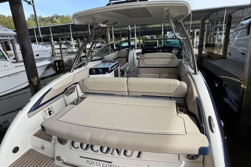 Slide: The Image of 2017 Formula 350 Crossover Bowrider with spacious seating, docked at marina. - 9