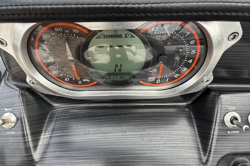 Slide: The Image of Dashboard of a 2019 Scarab 195G showing speedometer and RPM gauges. - 11