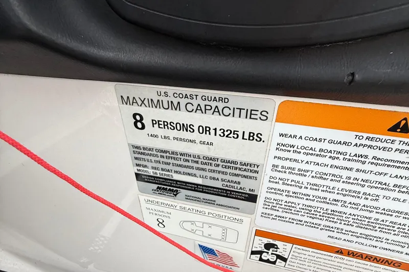 Slide: The Image of 2019 Scarab 195G capacity label, maximum 8 persons or 1325 lbs, safety instructions visible. - 12