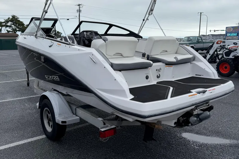 Slide: The Image of 2019 Scarab 195G boat on trailer, rear view in parking lot. - 4