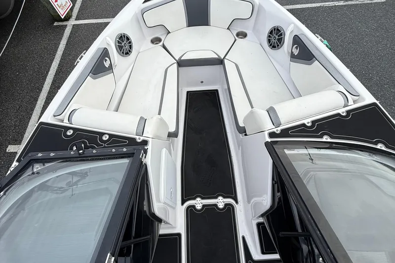 Slide: The Image of 2019 Scarab 195G boat interior with white and black seating and speakers. - 8