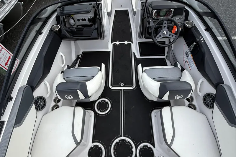 Slide: The Image of Interior of 2019 Scarab 195G boat with modern seating and dashboard design. - 9