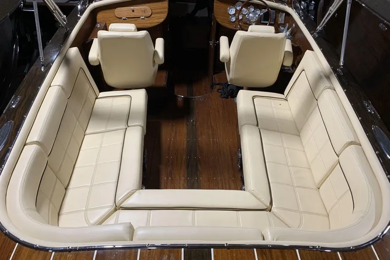 Slide: The Image of 2008 StanCraft 32 Deluxe boat with polished wooden deck in showroom. - 5