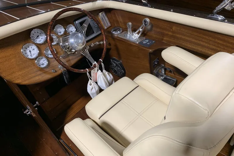 Slide: The Image of Luxurious interior of 2008 StanCraft 32 Deluxe boat with cream leather seats and wooden accents. - 7