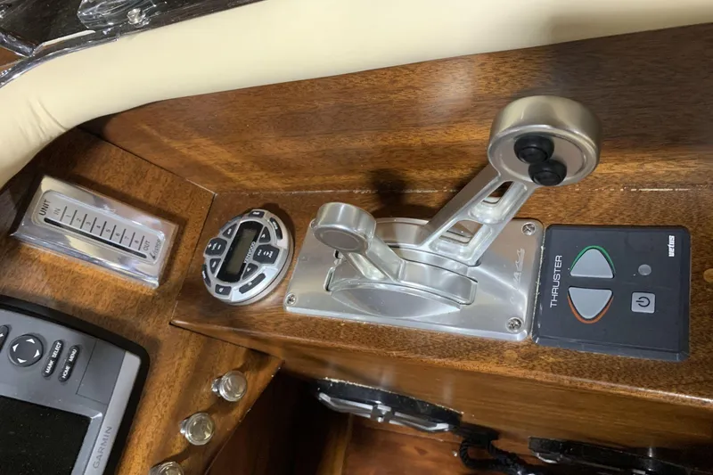 Slide: The Image of Interior of 2008 StanCraft 32 Deluxe boat with wooden dashboard and cream leather seats. - 8