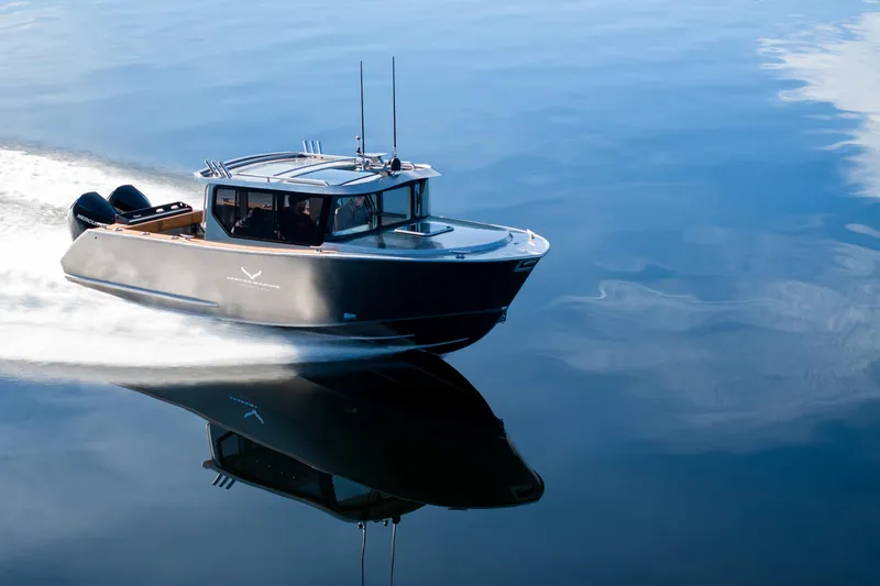 Slide: The Image of 2026 Jasper Marine Defender 22 cruising swiftly on open water. - 23
