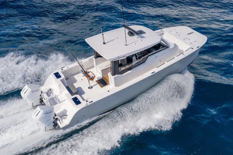 Slide: The Image of 2026 Hammer Yachts 35HH cruising on open water, showcasing sleek design and powerful engines. - 0