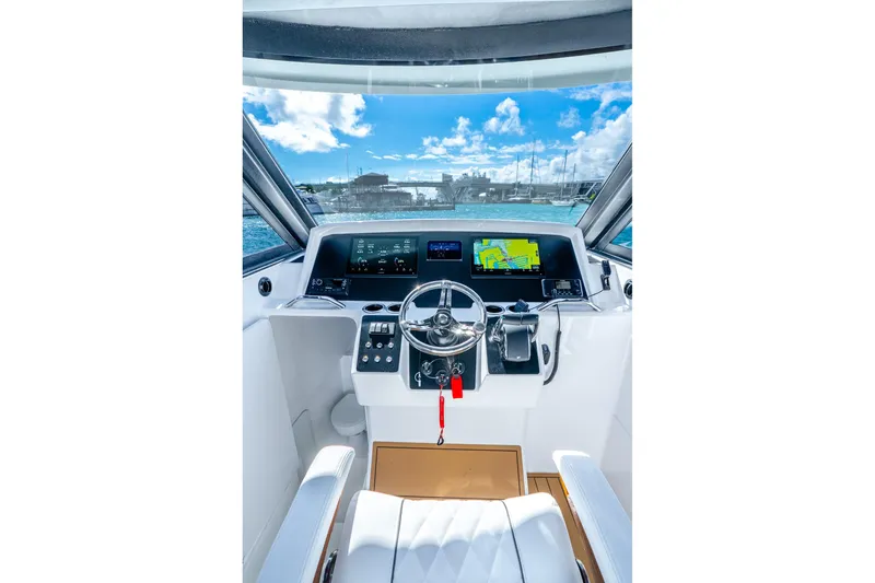 Slide: The Image of Helm of 2026 Hammer Yachts 35HH with modern navigation displays and controls. - 20