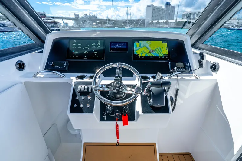 Slide: The Image of Cockpit of 2026 Hammer Yachts 35HH with modern navigation displays and steering wheel. - 23