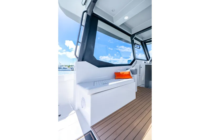 Slide: The Image of Interior of 2026 Hammer Yachts 35HH with modern seating and ocean view. - 26