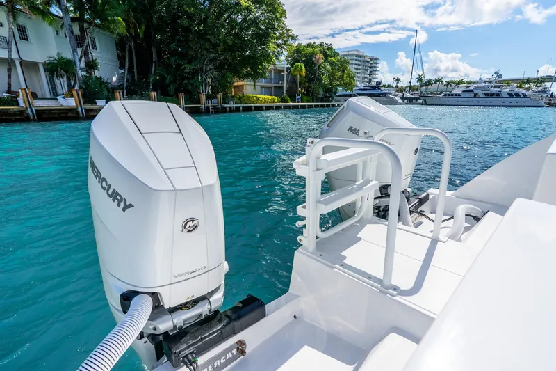 Slide: The Image of 2026 Hammer Yachts 35HH with Mercury outboard engines on a sunny waterfront. - 29