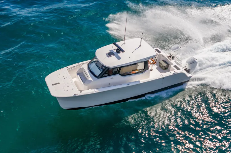 Slide: The Image of 2026 Hammer Yachts 35HH cruising on vibrant blue ocean waters. - 6