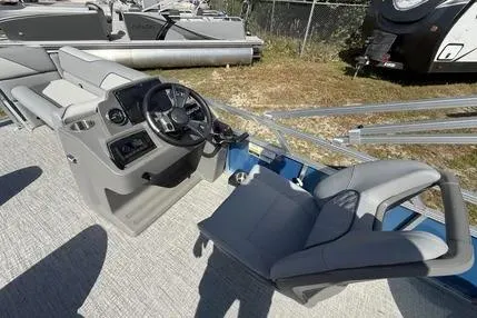 Slide: The Image of 2026 Avalon Venture QL boat interior with steering console and seating. - 4