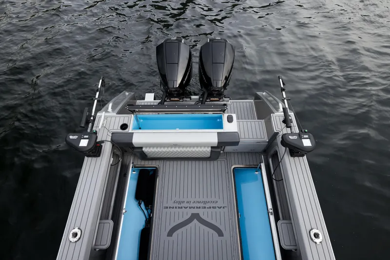 Slide: The Image of 2026 Jasper Marine Defender 22 cruising on serene waters with mountainous backdrop. - 10