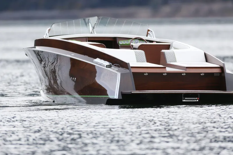 Slide: The Image of 2025 StanCraft 290 Rivelle luxury boat on calm water, showcasing sleek design and elegance. - 10