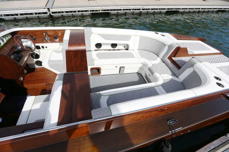 Slide: The Image of Luxurious 2025 StanCraft 290 Rivelle boat interior with elegant wood and white seating. - 12