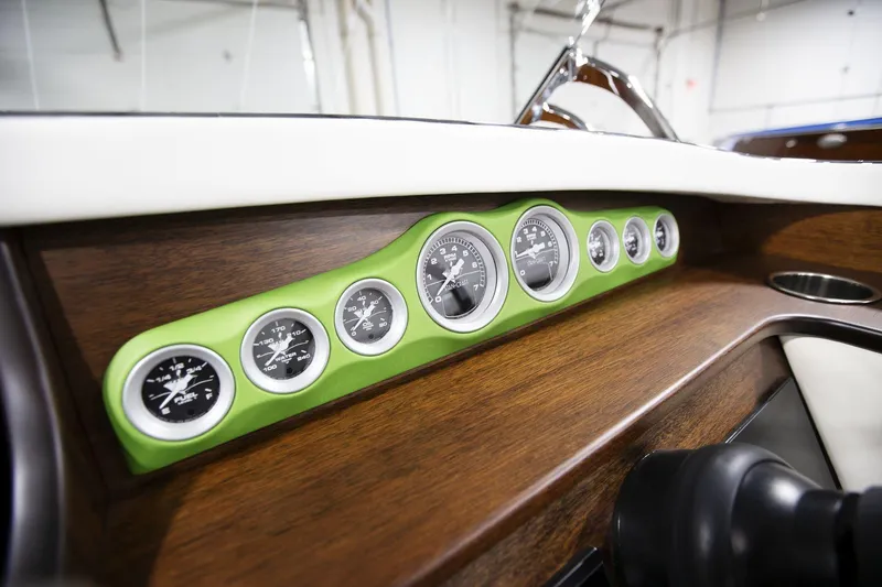 Slide: The Image of Dashboard of 2025 StanCraft 290 Rivelle with green-trimmed gauges and wood finish. - 15