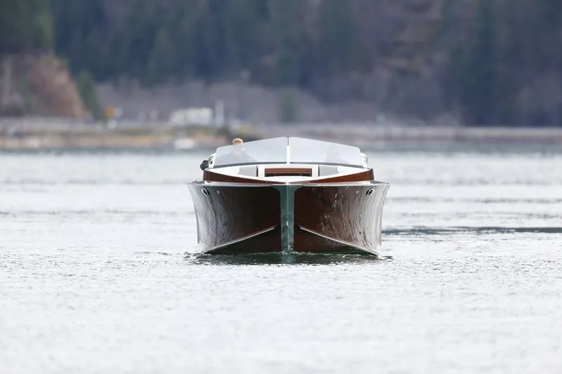 Slide: The Image of 2025 StanCraft 290 Rivelle luxury boat cruising on a serene lake. - 3